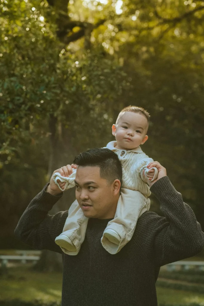 Dad carrying toddler