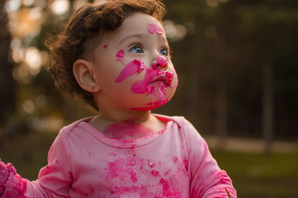 Toddler with paint on their face